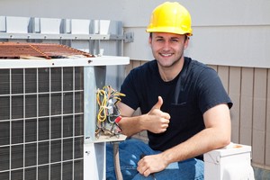 Technician working on an outdoor AC unit.