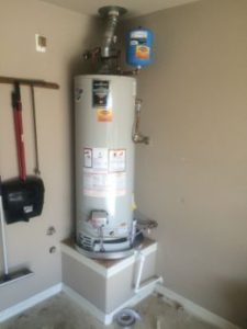 Gray water heater in the extra room of a house.